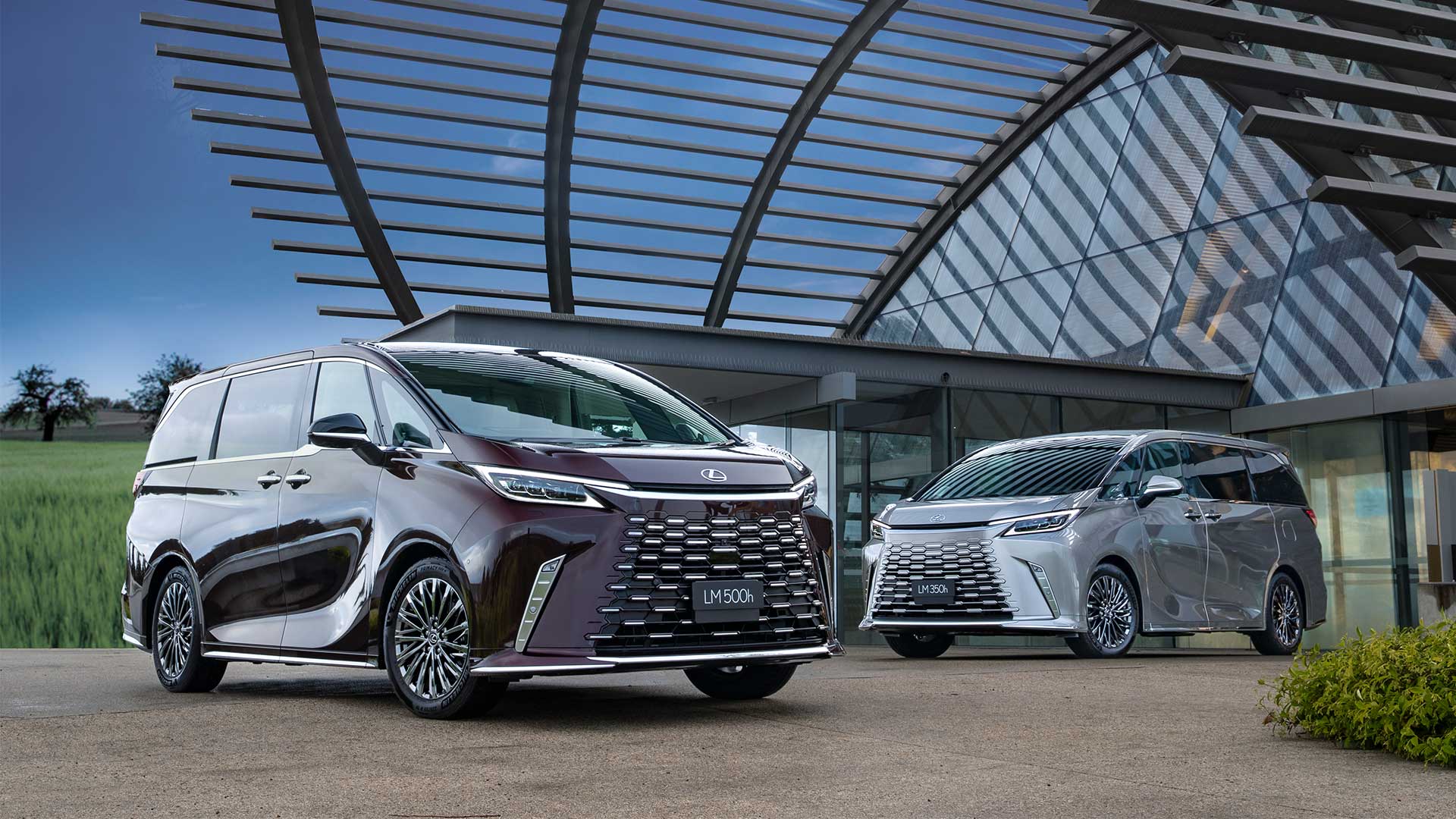 2024 Lexus LM 500h (L) and LM 350h (R). LM 500h overseas pre-production model shown. Australian grades, features & specifications may differ.